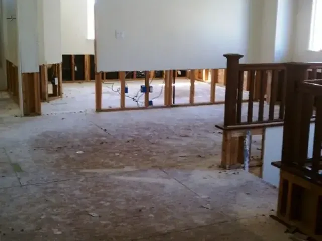 Lower wall sections removed to expose framing above a bare floor