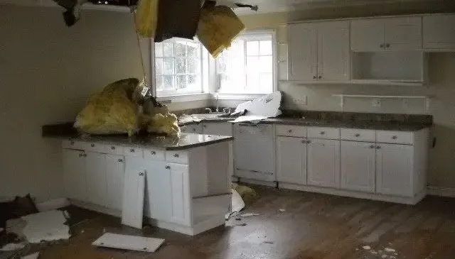 Kitchen ceiling collapsed with wet insulation after a leak above